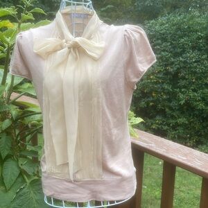 Carolina Herrera silk knit top with silk chiffon placard and scarf or bow.
